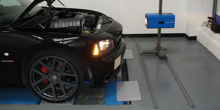 Testing the headlights of the Dodge Charger at Stuart Wright Transport